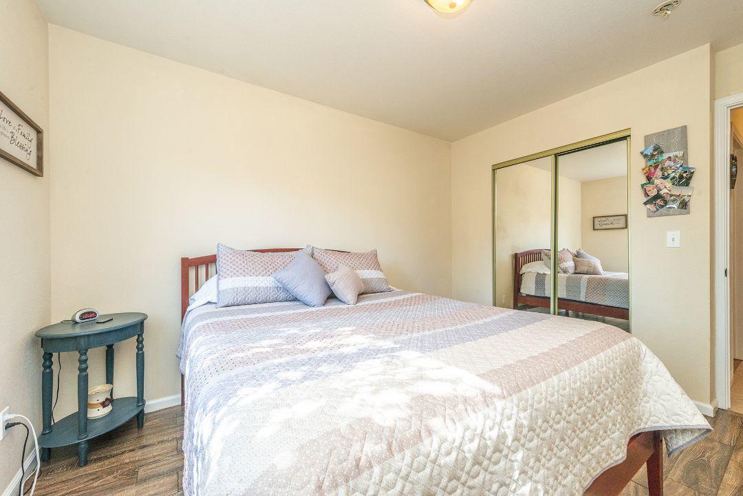 2771 North Street Anderson, CA 96007 - Photo 30 of 55 a large bed sitting in a bedroom and a table
