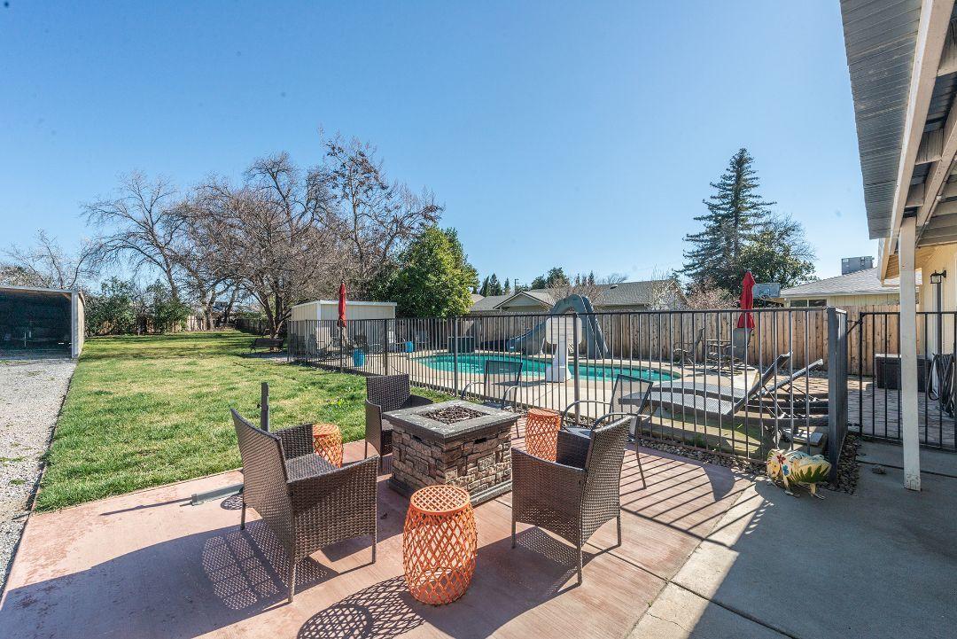 2771 North Street Anderson, CA 96007 - Photo 33 of 55 a view of a patio with couches chairs and a fire pit