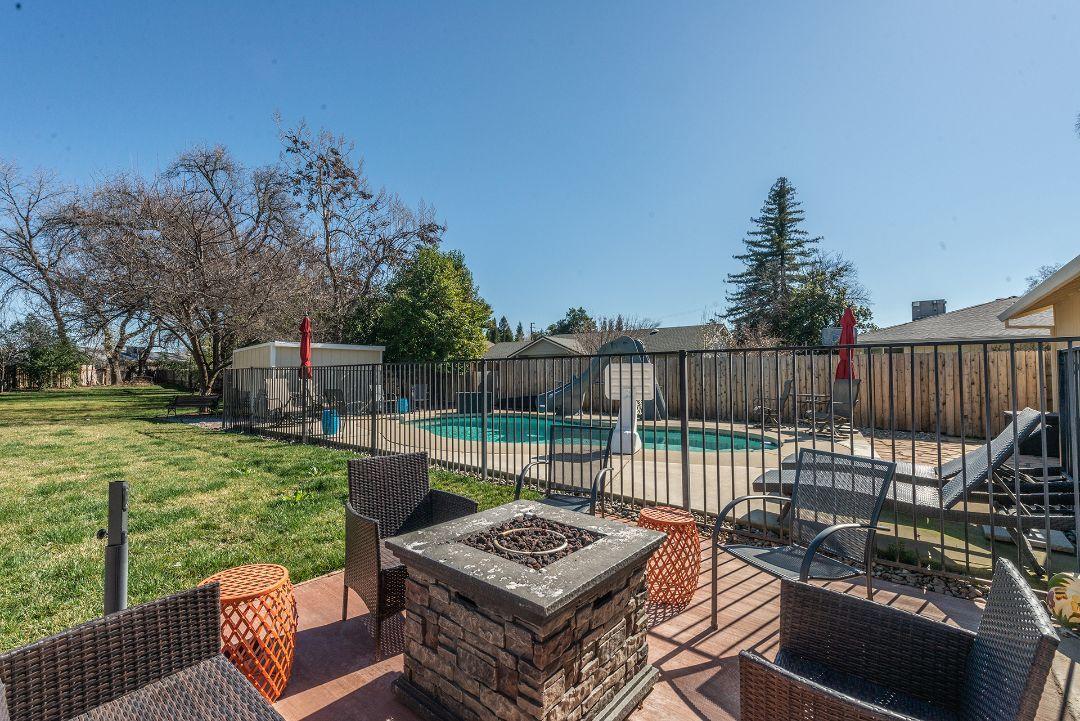 2771 North Street Anderson, CA 96007 - Photo 36 of 55 a view of a chair and tables in the backyard
