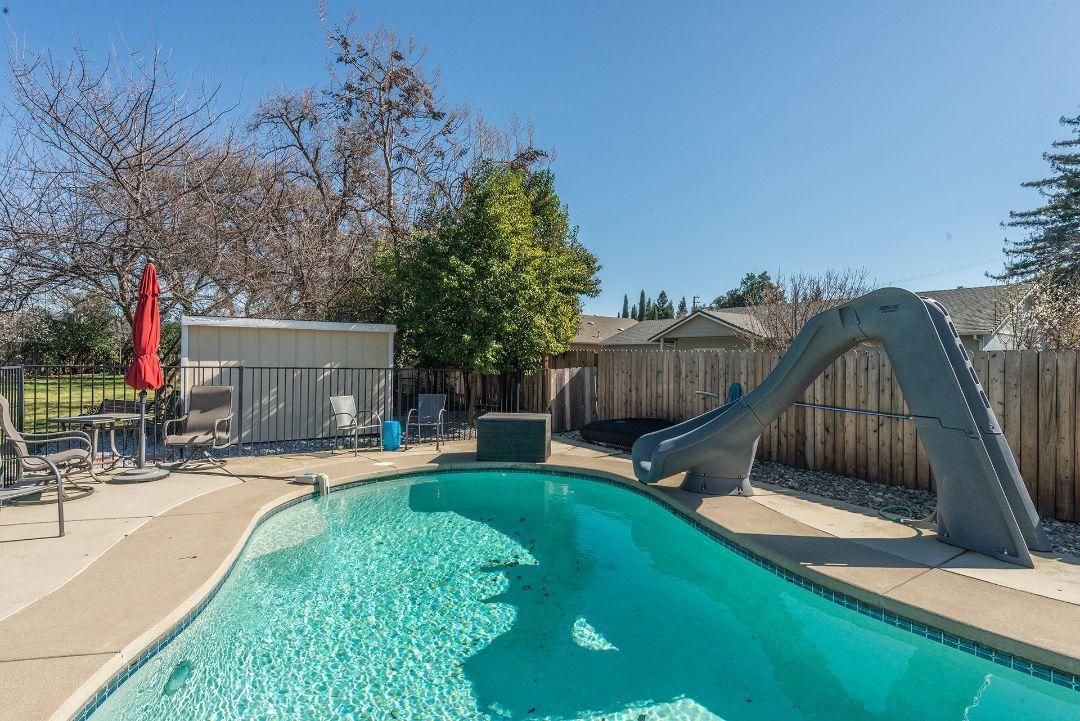 2771 North Street Anderson, CA 96007 - Photo 38 of 55 a view of a backyard with a slide