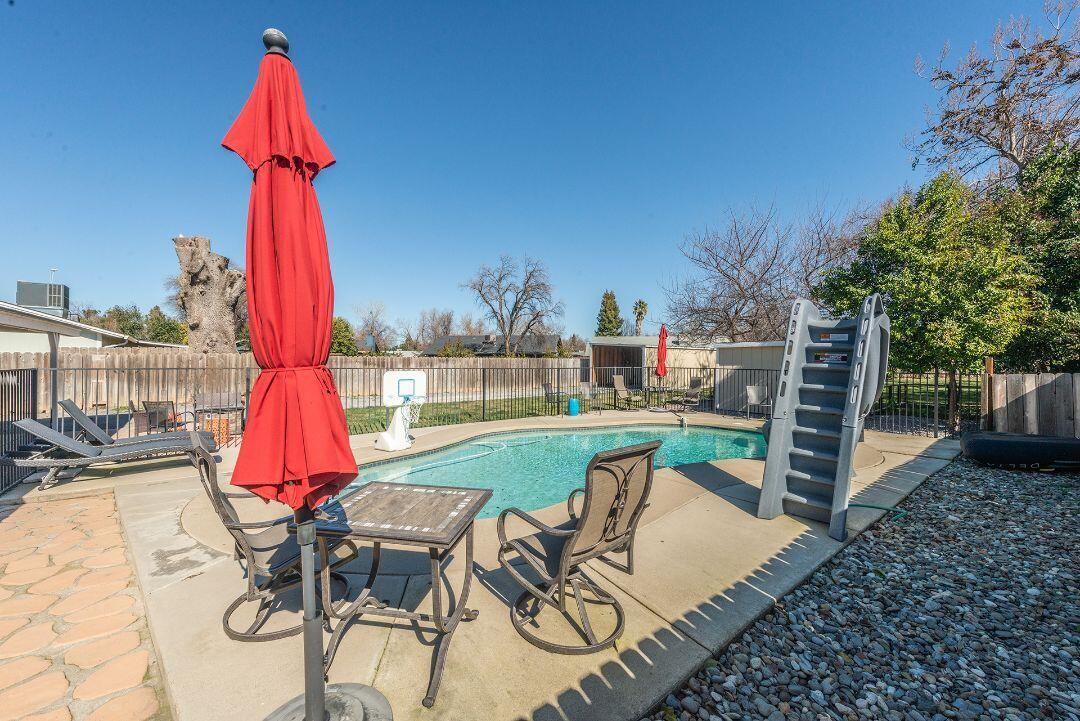 2771 North Street Anderson, CA 96007 - Photo 40 of 55 a view of backyard with swimming pool and seating