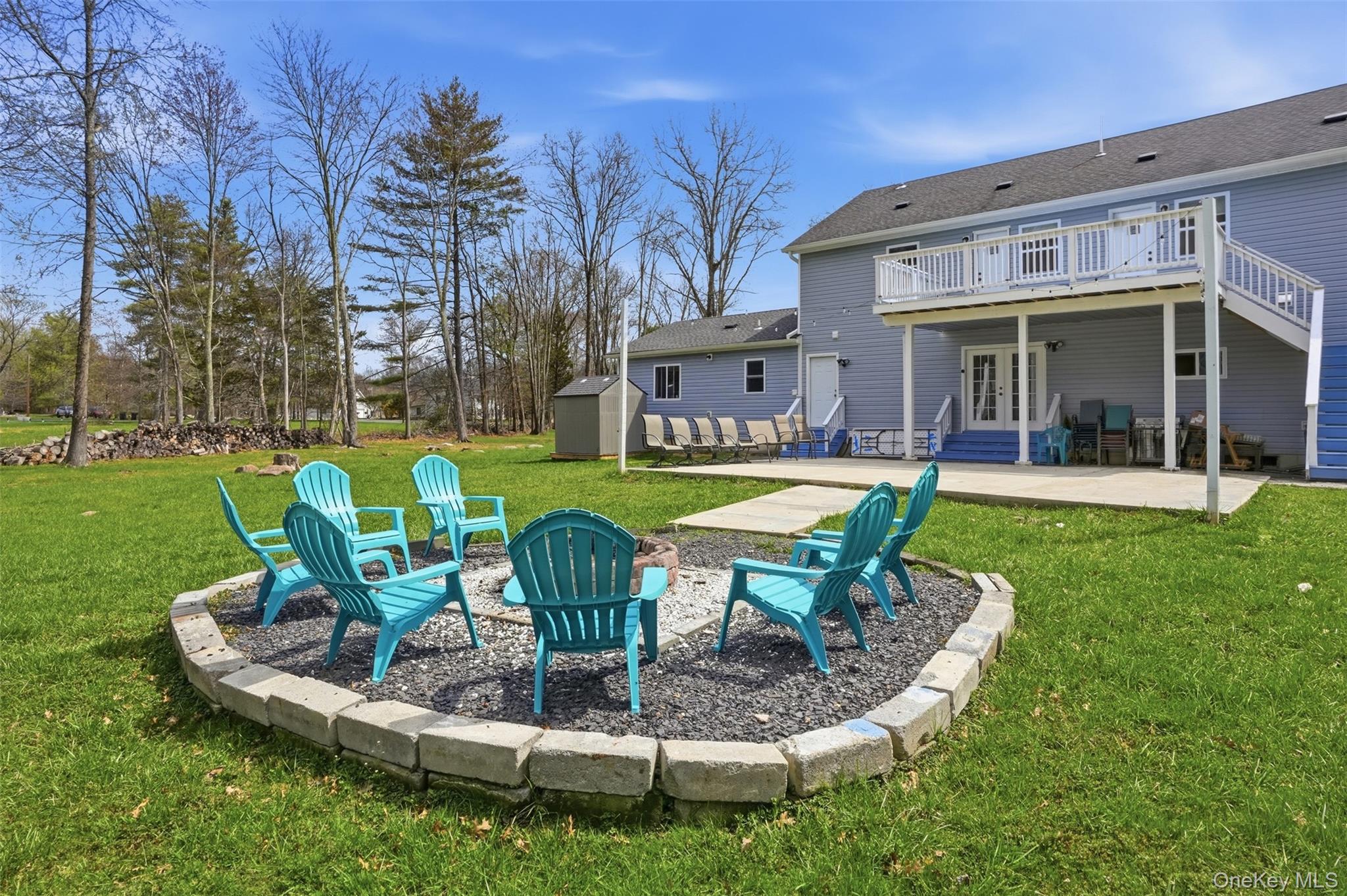 2428 Bruynswick Road Wallkill, NY 12589 - Photo 11 of 12 a view of a house with a yard patio and sitting area