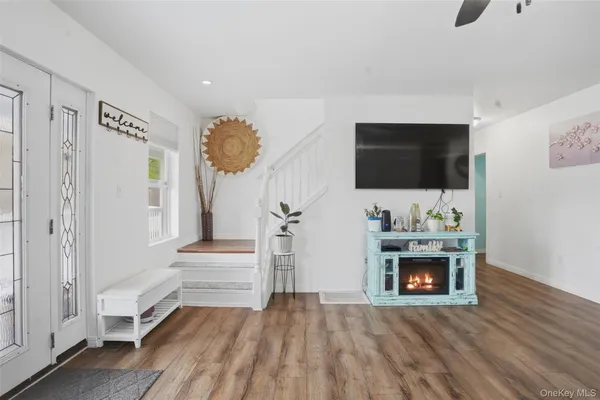 a view of livingroom with furniture and flat screen tv