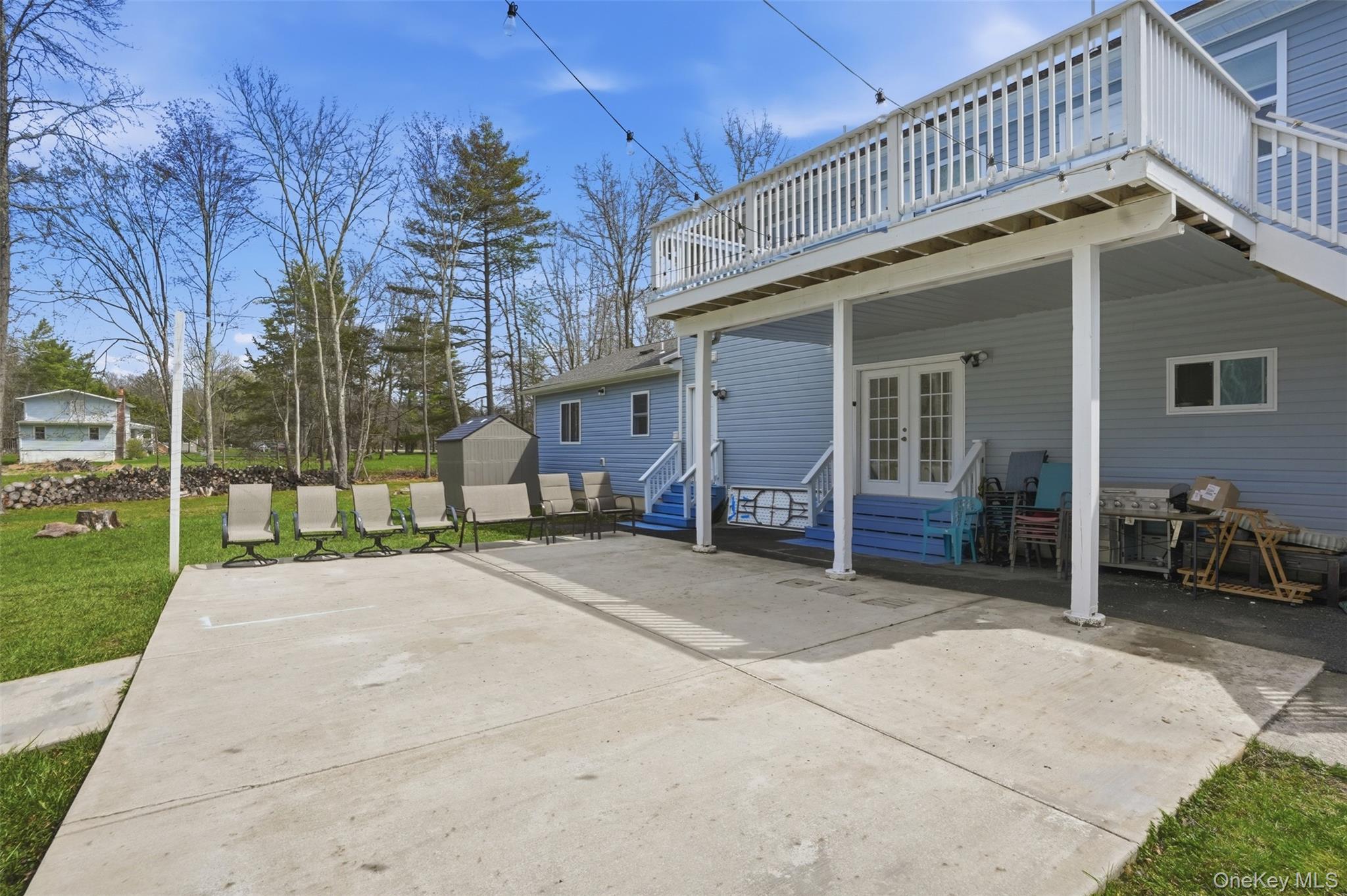 2428 Bruynswick Road Wallkill, NY 12589 - Photo 10 of 12 a view of a house with a patio and a yard