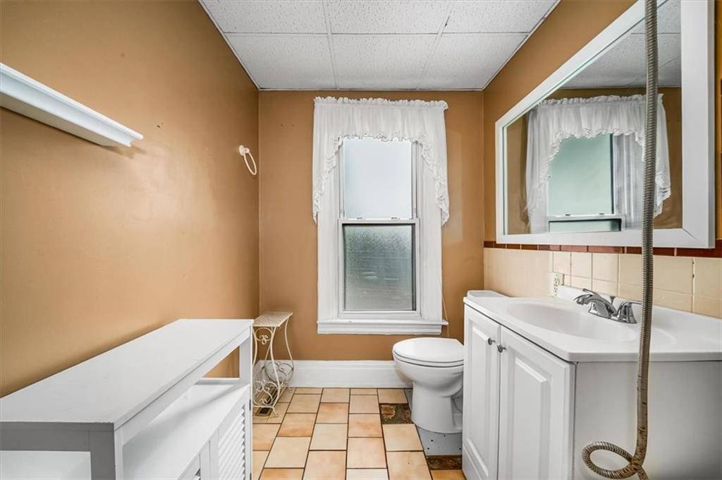 216 6th Street Monaca, PA 15061 - Photo 15 of 31 a bathroom with a sink toilet and shower