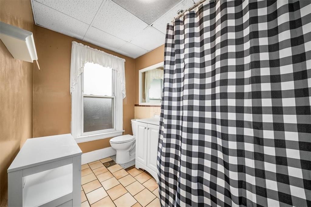 216 6th Street Monaca, PA 15061 - Photo 16 of 31 a bathroom with a sink toilet and shower