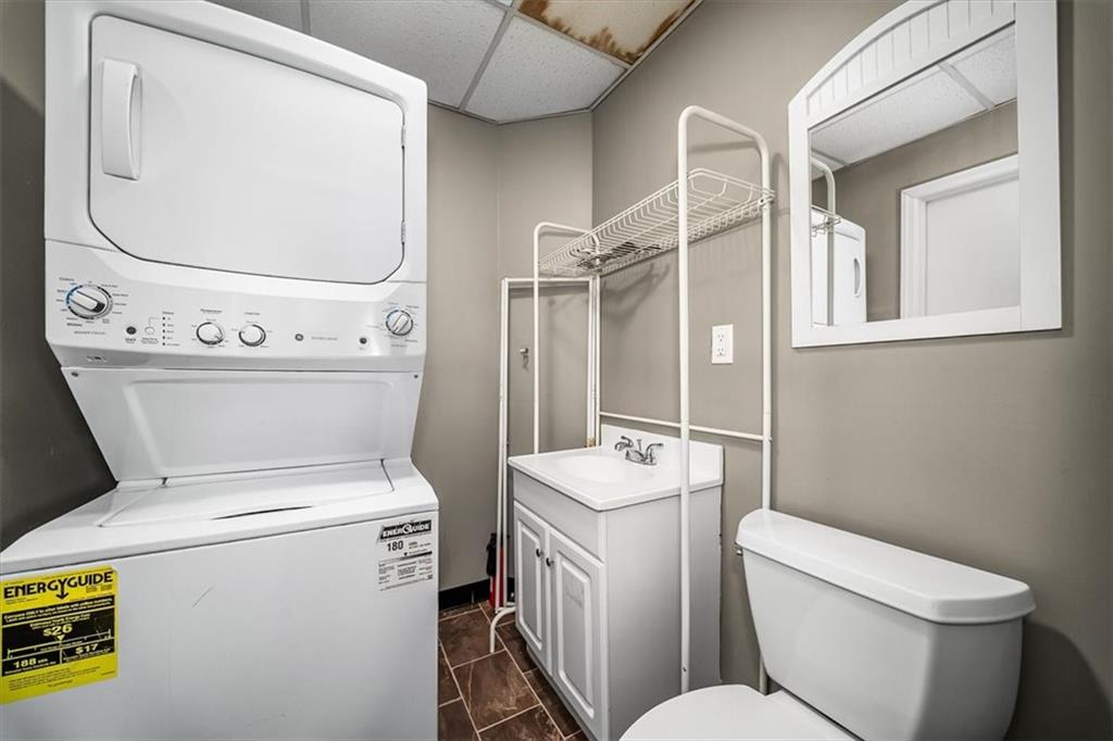 216 6th Street Monaca, PA 15061 - Photo 19 of 31 a bathroom with a toilet and a mirror