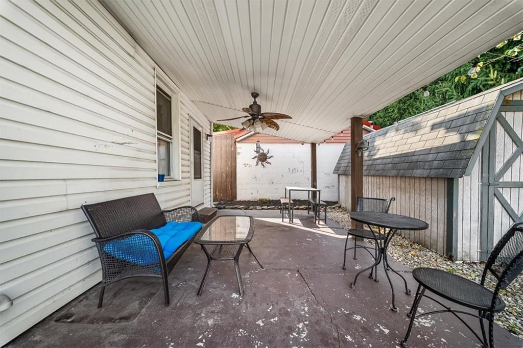 216 6th Street Monaca, PA 15061 - Photo 21 of 31 a view of a patio with table and chairs and potted plants