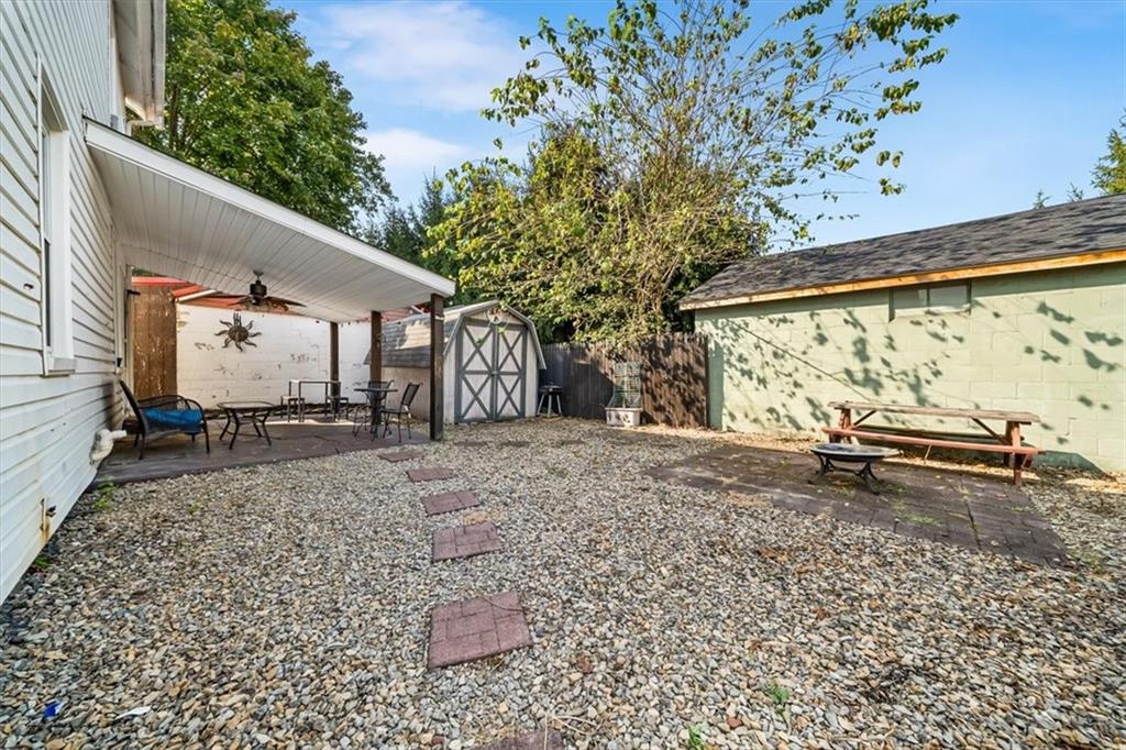 216 6th Street Monaca, PA 15061 - Photo 22 of 31 a backyard of a house with barbeque oven table and chairs