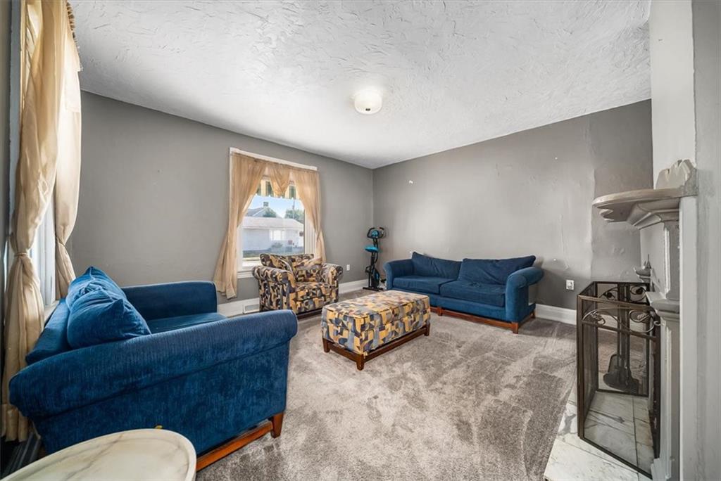 216 6th Street Monaca, PA 15061 - Photo 6 of 31 a living room with furniture and a window
