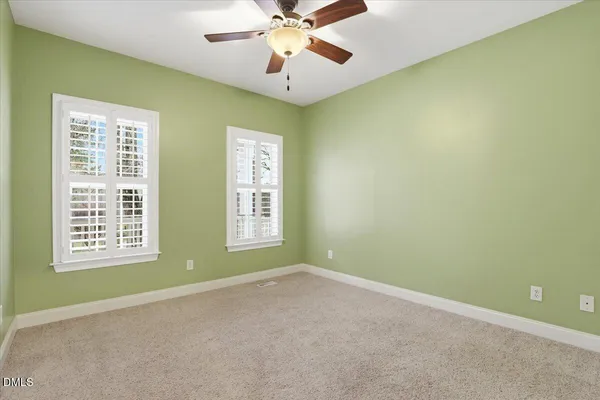 a spacious bathroom with a double vanity sink mirror and double