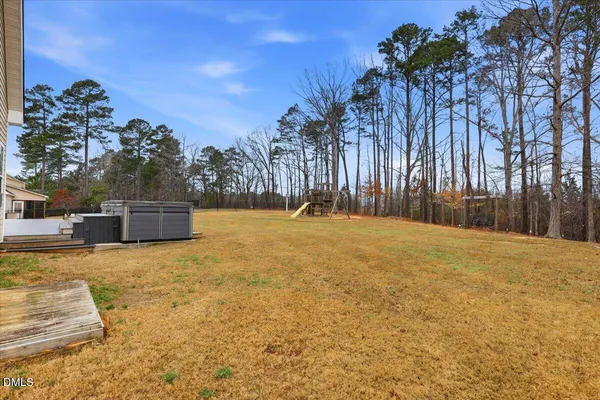 a row of trees and electric fence