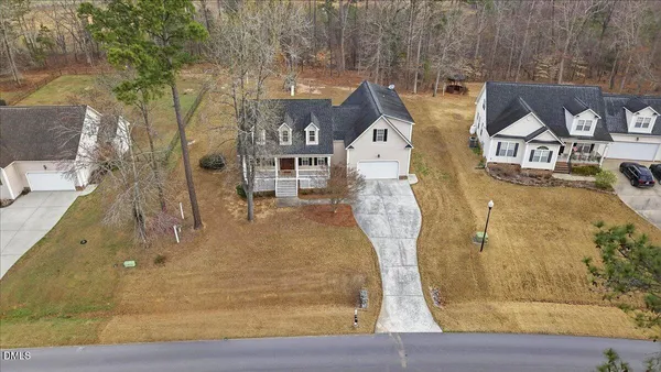 an aerial view of residential houses with outdoor space
