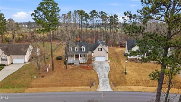 a view of a swimming pool with a patio and mountain view