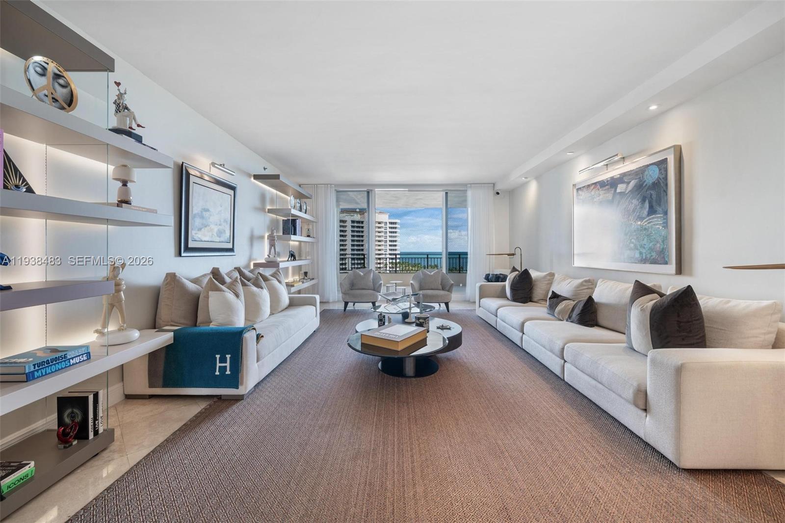 799 Crandon Boulevard, Unit 908 Key Biscayne, FL 33149 - Photo 1 of 30 a living room with furniture and a large window