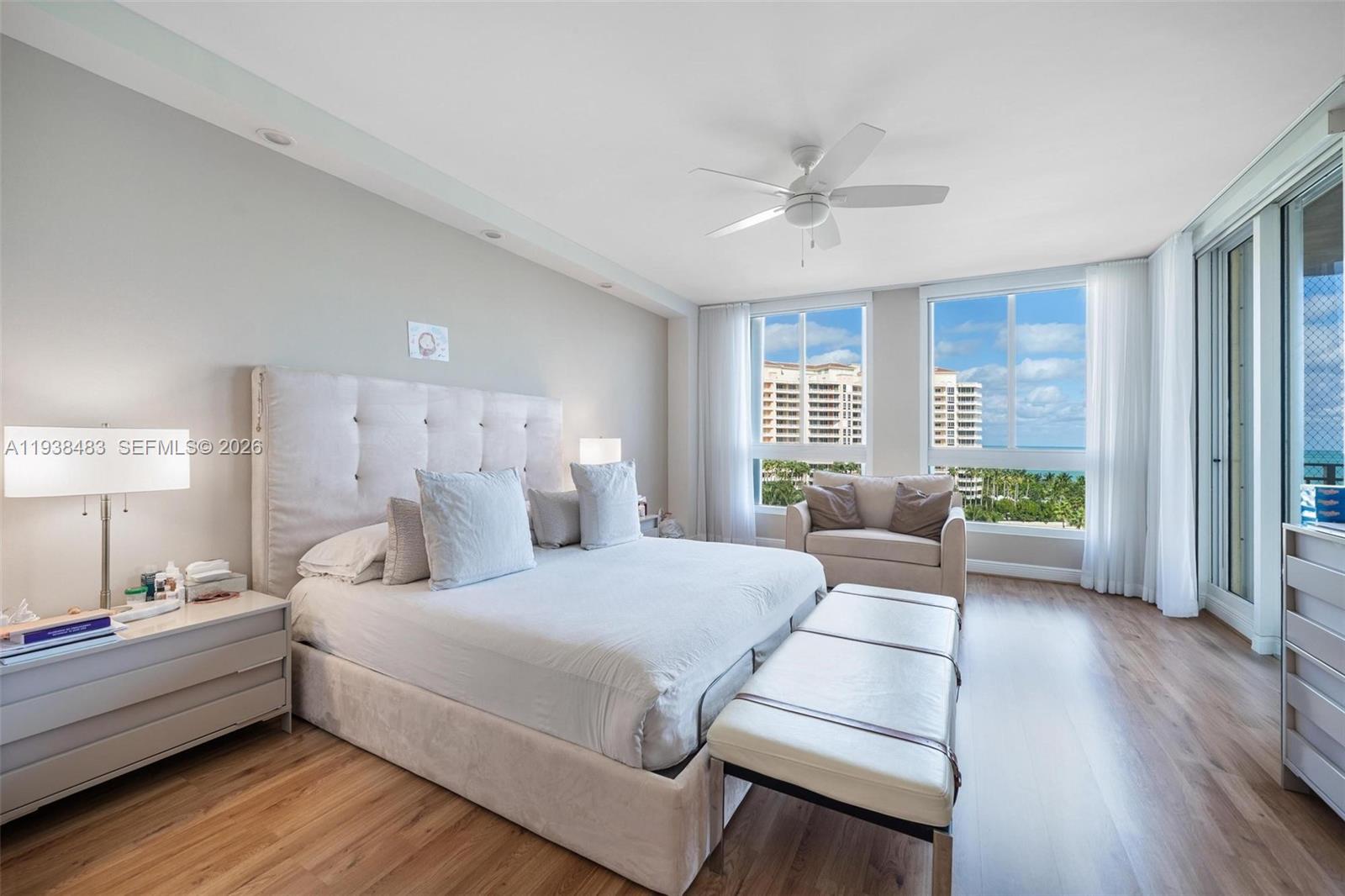 799 Crandon Boulevard, Unit 908 Key Biscayne, FL 33149 - Photo 15 of 30 a bedroom with a bed and a couch