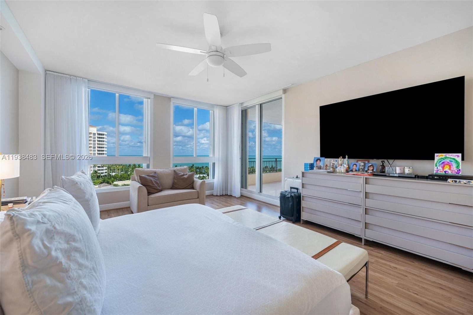 799 Crandon Boulevard, Unit 908 Key Biscayne, FL 33149 - Photo 16 of 30 a room with furniture and a flat screen tv
