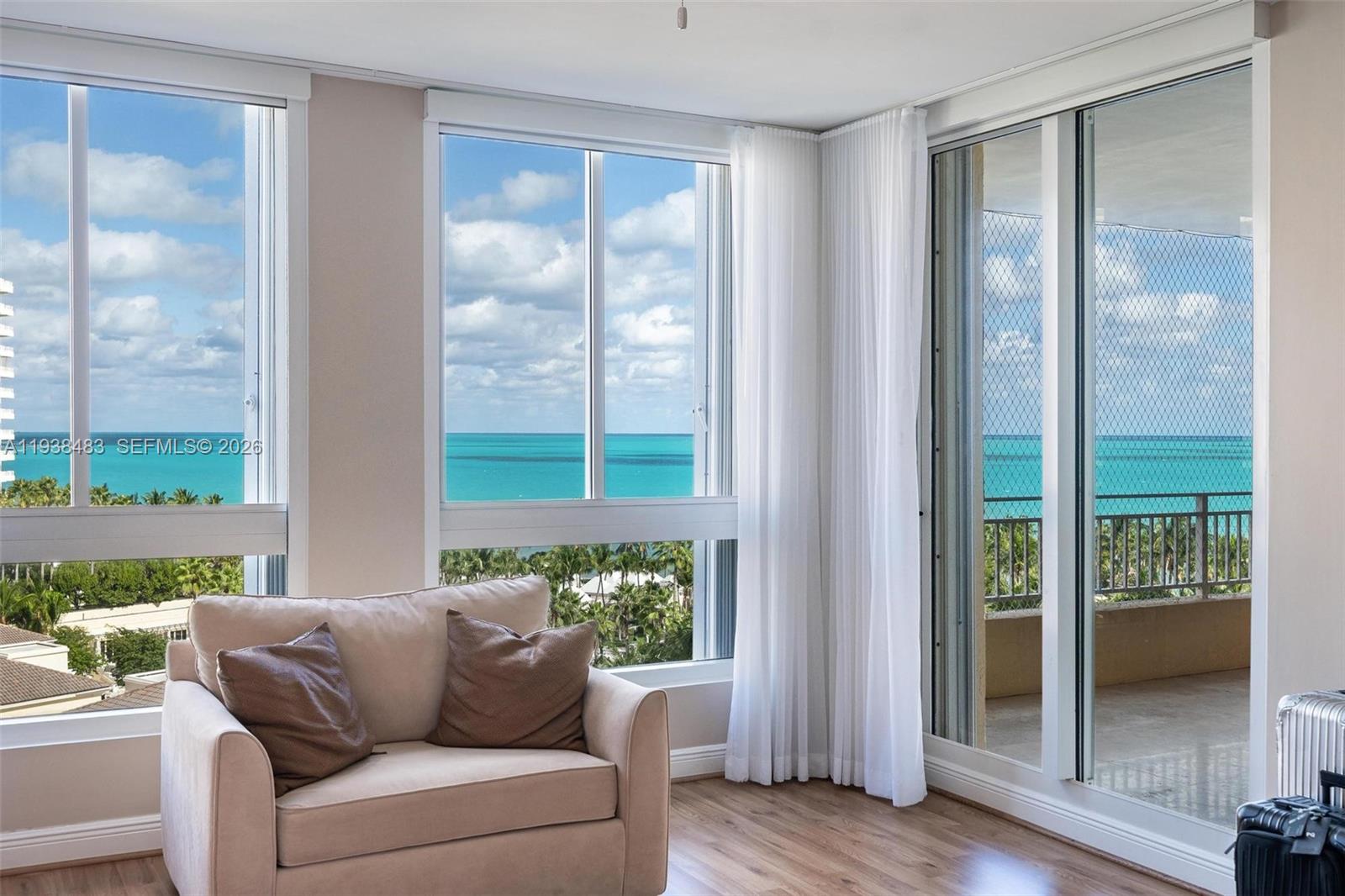 799 Crandon Boulevard, Unit 908 Key Biscayne, FL 33149 - Photo 17 of 30 a living room with furniture and a window