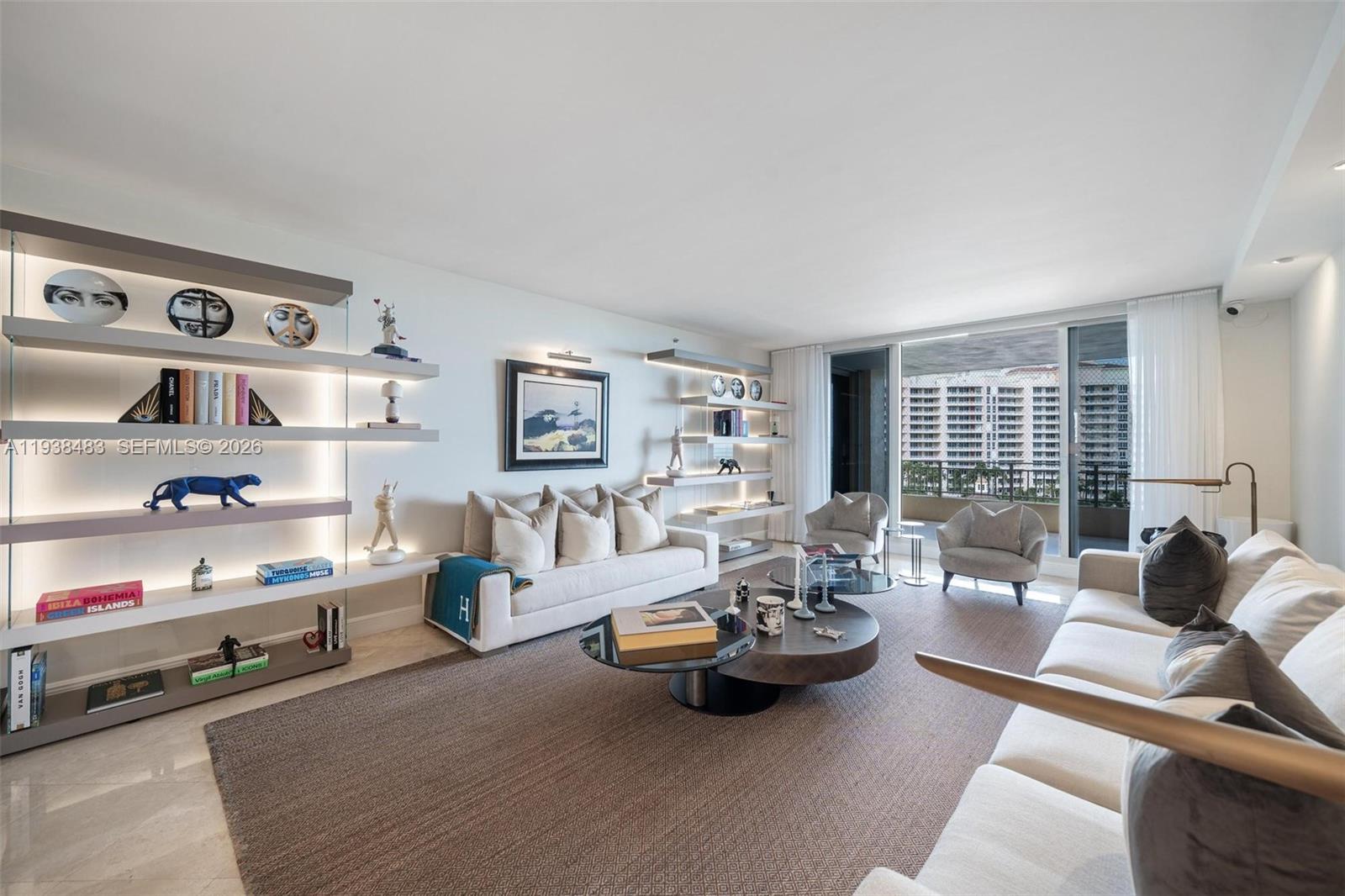 799 Crandon Boulevard, Unit 908 Key Biscayne, FL 33149 - Photo 2 of 30 a living room with furniture and a wooden floor