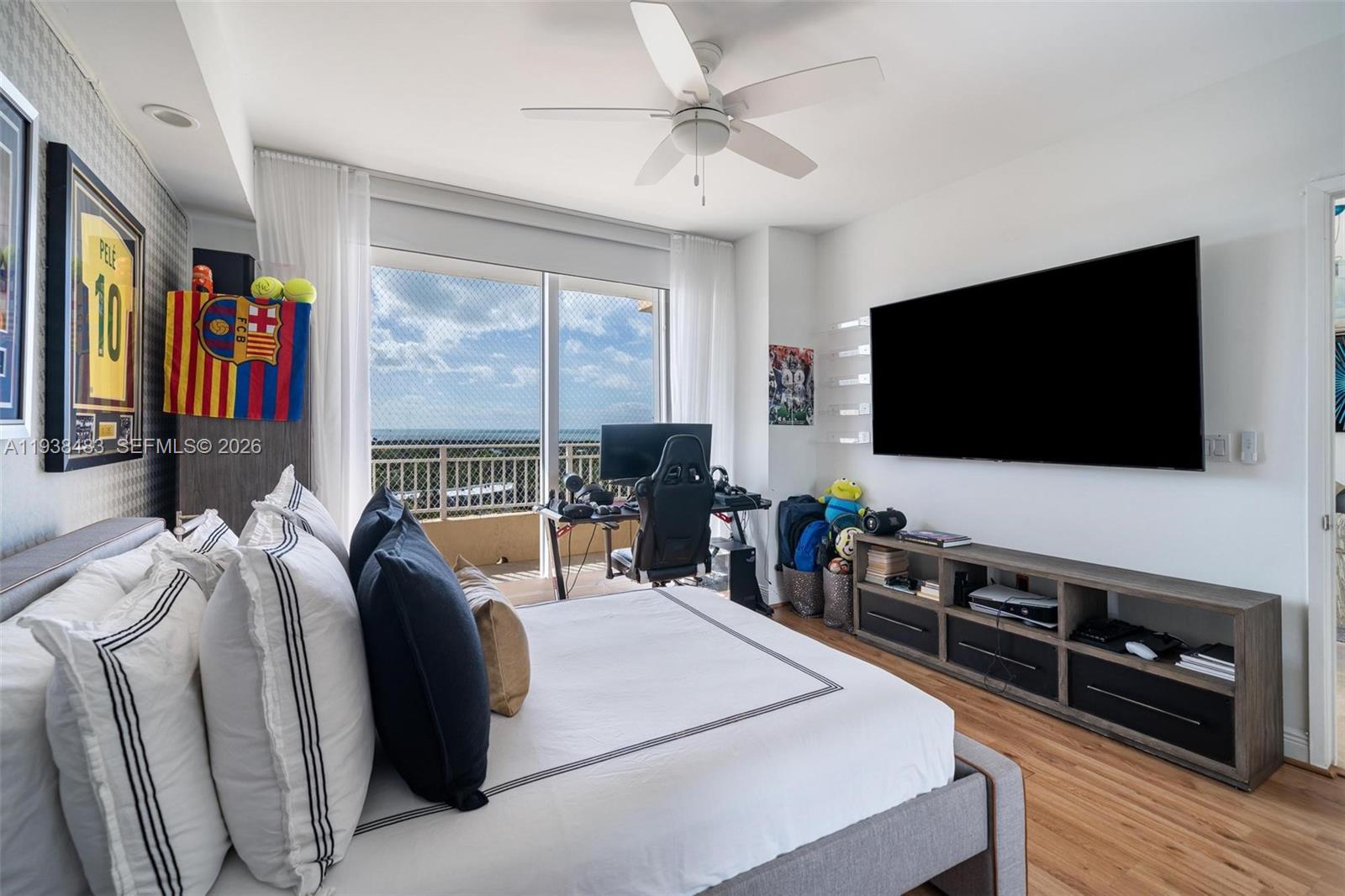 799 Crandon Boulevard, Unit 908 Key Biscayne, FL 33149 - Photo 23 of 30 a living room with furniture and a flat screen tv
