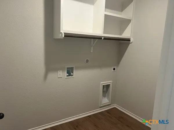 a view of a bathroom with wooden floor