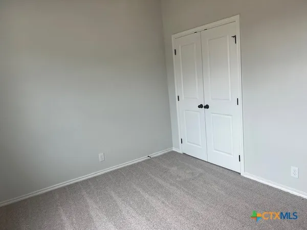 a kitchen with kitchen island a sink a stove and wooden floors