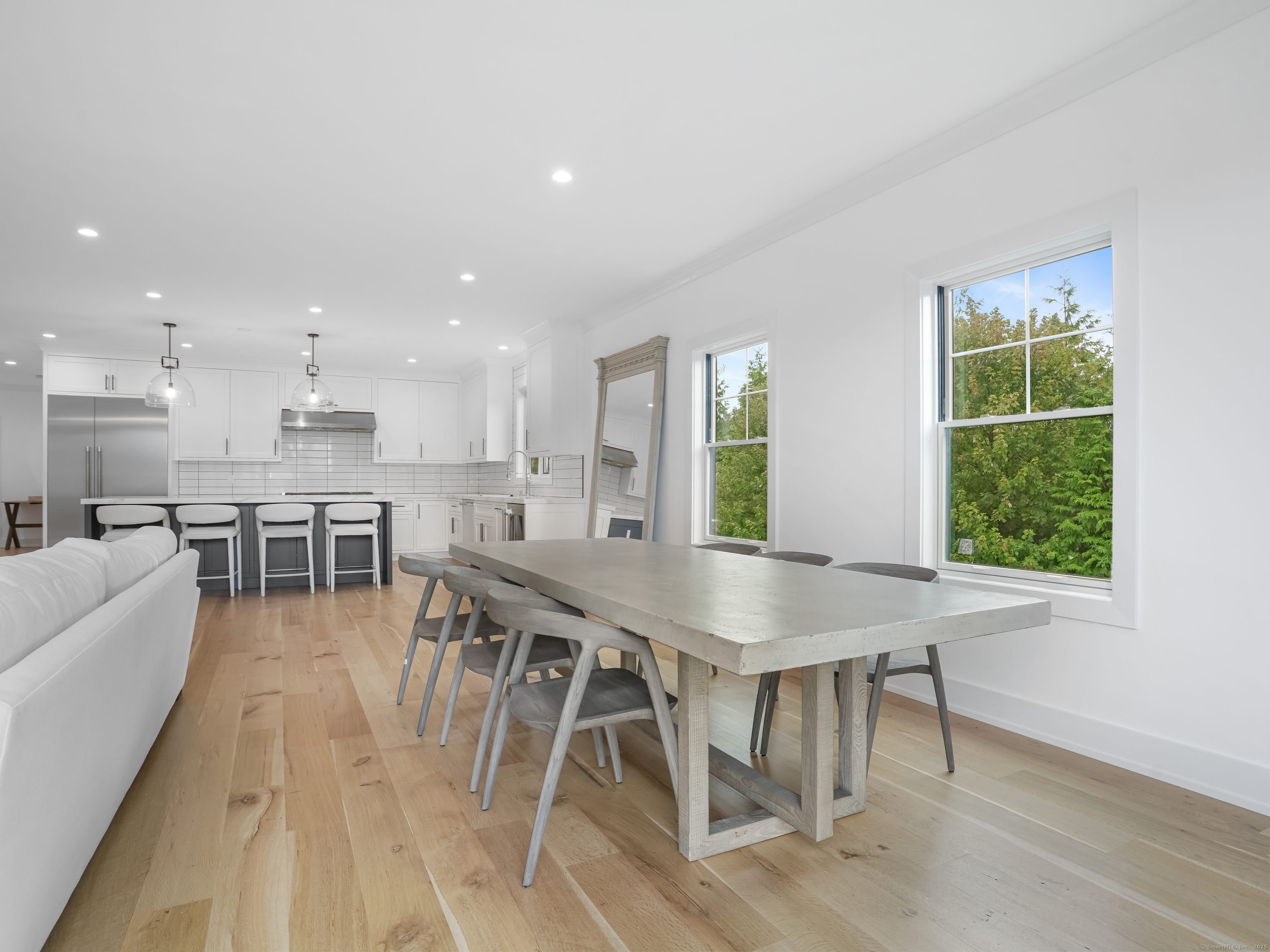 345 Reef Road, Unit C9 Fairfield, CT 06824 - Photo 14 of 39 a view of a dining room with furniture and a large window