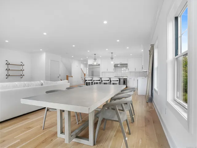 a kitchen with a table and chairs in it