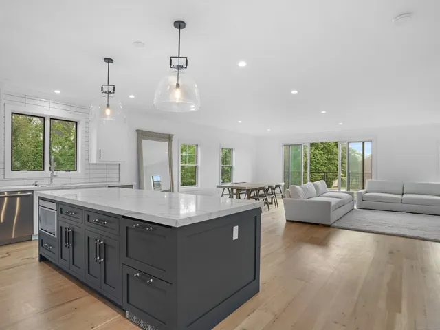 a view of living room with granite countertop furniture and a large window