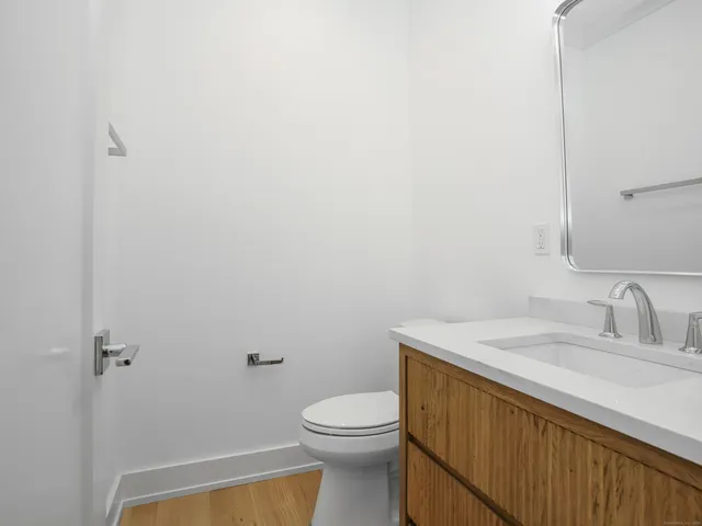 a bedroom with a large bed and a large window