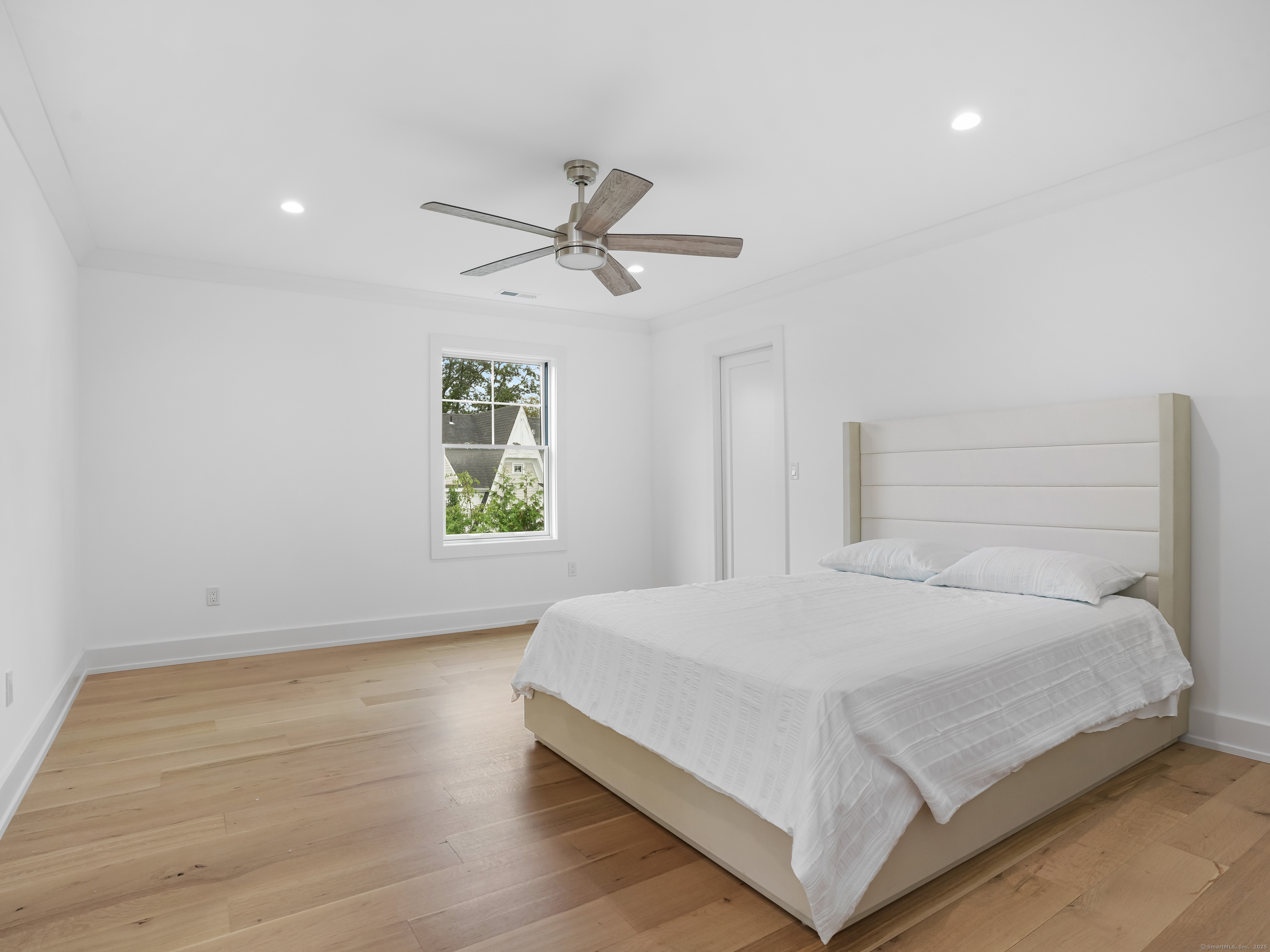 345 Reef Road, Unit C9 Fairfield, CT 06824 - Photo 27 of 39 a bedroom with a bed and a window