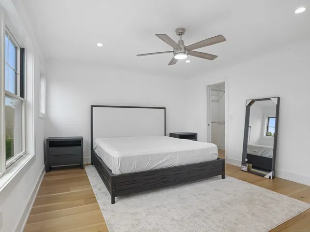 a white bath tub sitting next to a white toilet and sink