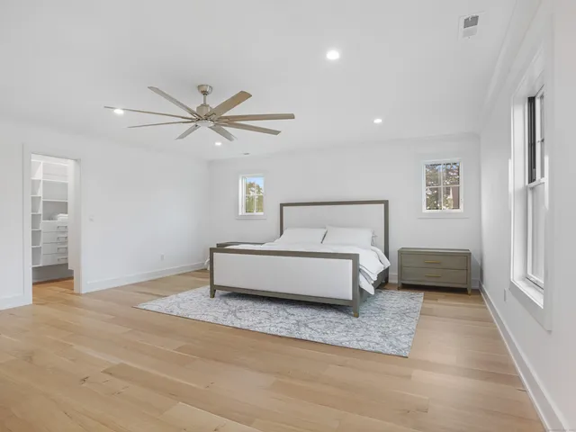 a bathroom with a sink shower and a mirror