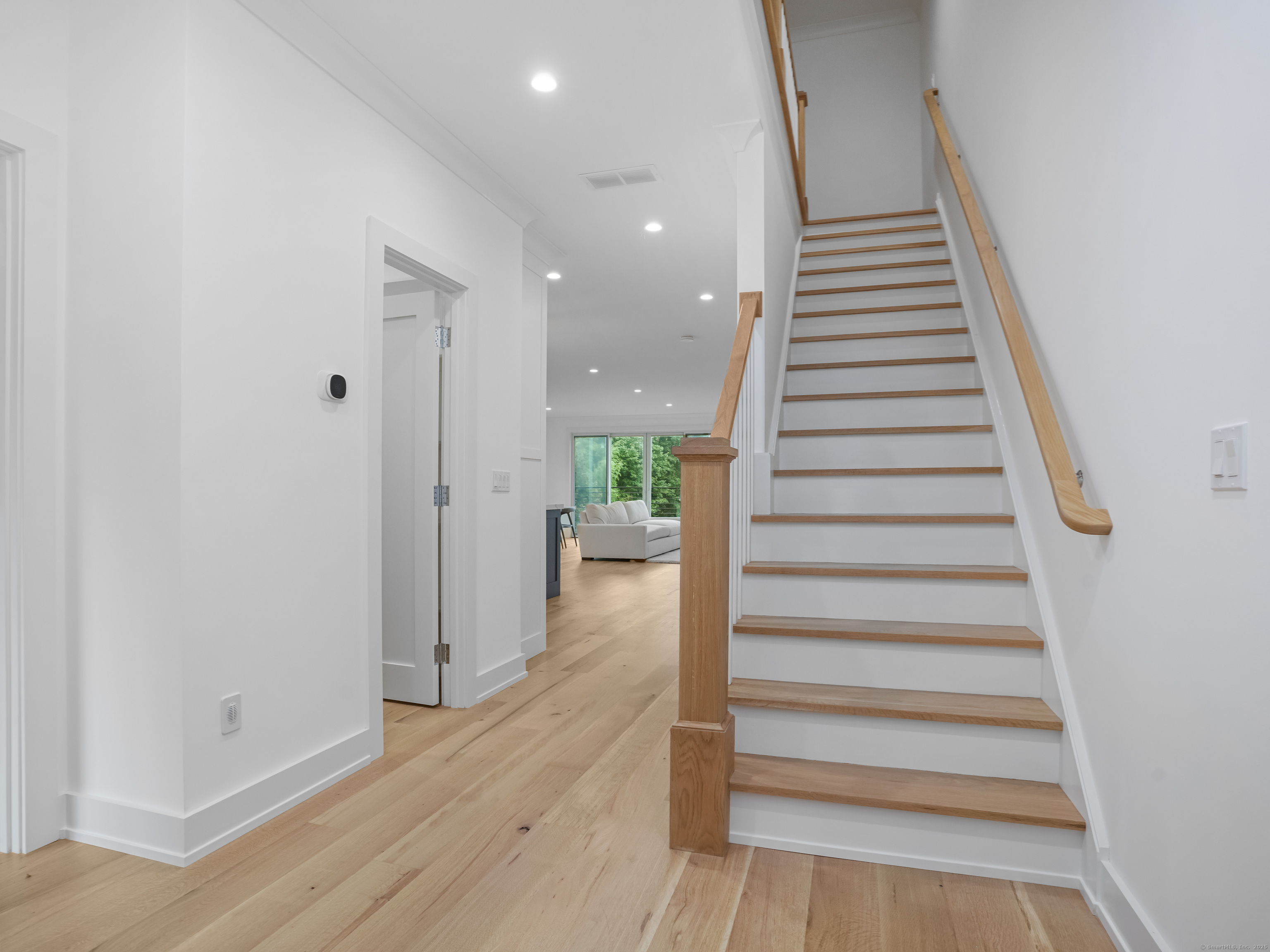 345 Reef Road, Unit C9 Fairfield, CT 06824 - Photo 10 of 39 a view of entryway with wooden floor