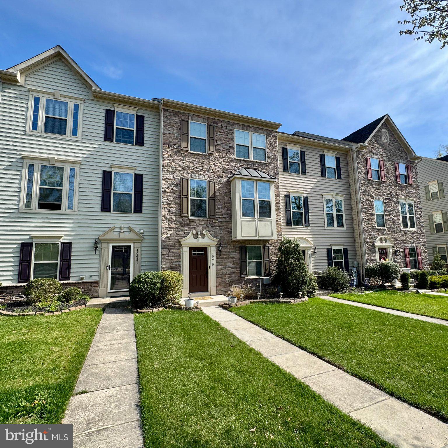 10419 Campbell Boulevard Middle River, MD 21220 - Photo 2 of 2 Charming townhomes with lush greenery.
