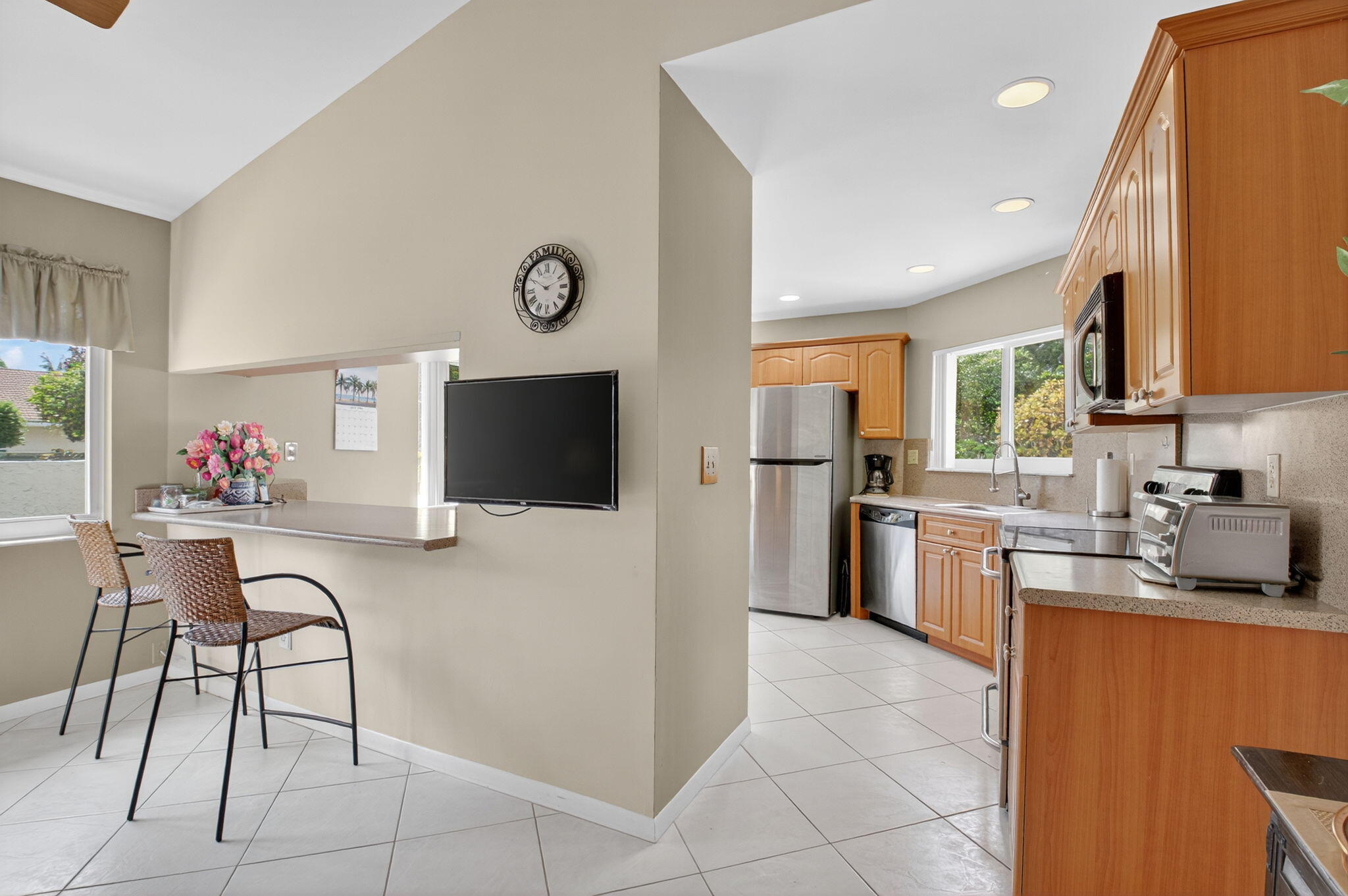 6290 Sweet Maple Lane Boca Raton, FL 33433 - Photo 15 of 35 a kitchen with granite countertop a refrigerator and a stove top oven