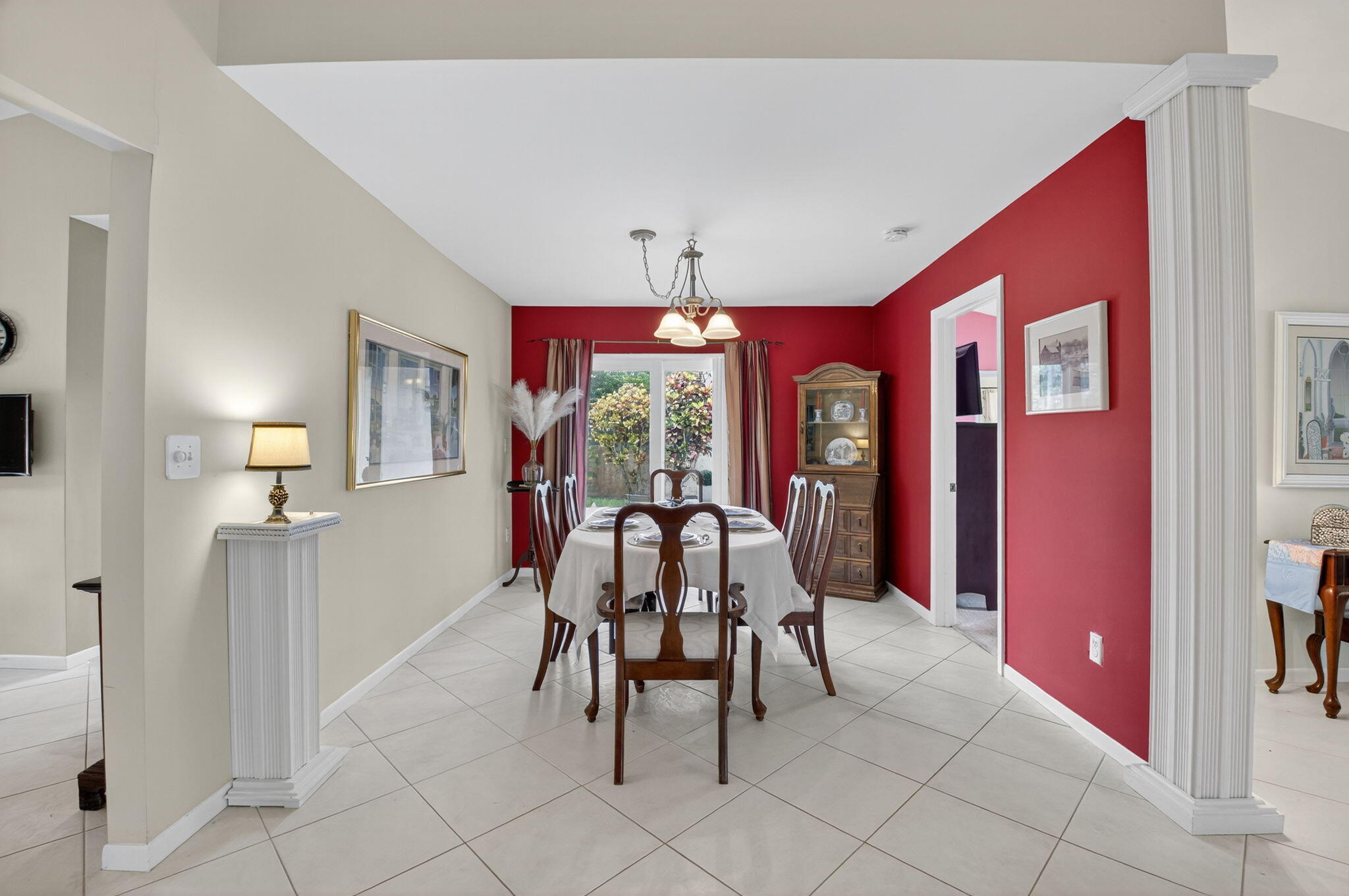 6290 Sweet Maple Lane Boca Raton, FL 33433 - Photo 16 of 35 a view of a dining room with furniture and chandelier