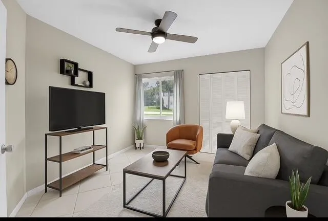 a living room with furniture and a flat screen tv