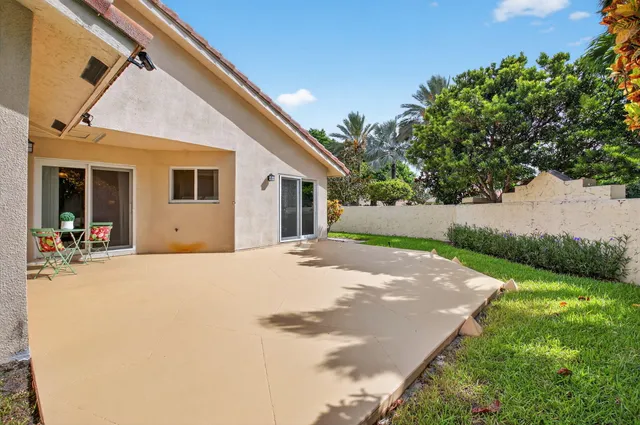 a house view with a backyard space