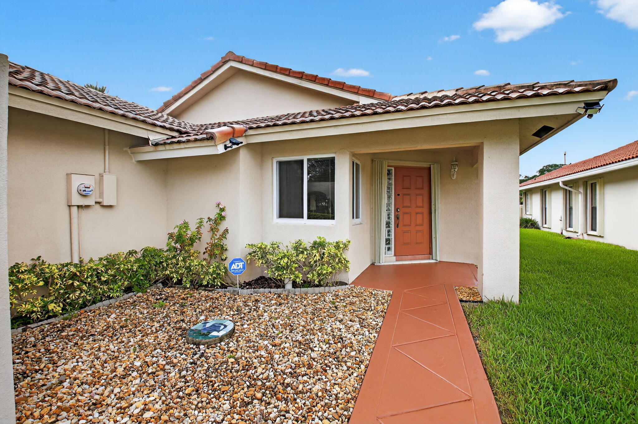 6290 Sweet Maple Lane Boca Raton, FL 33433 - Photo 3 of 35 a front view of a house with garden