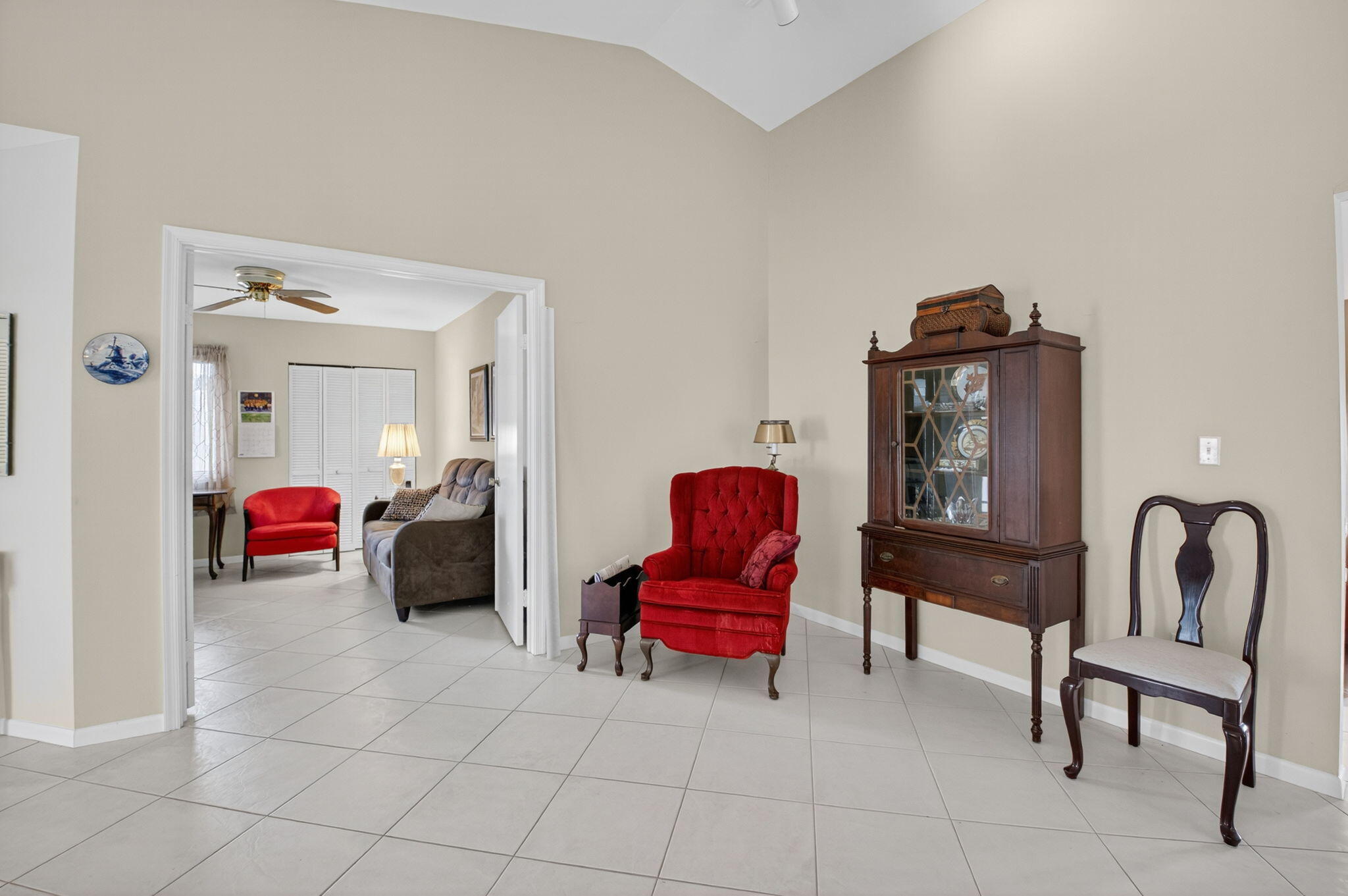 6290 Sweet Maple Lane Boca Raton, FL 33433 - Photo 7 of 35 a living room with furniture and a chair
