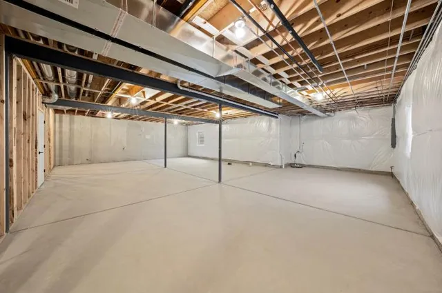 a bathroom with a shower and a sink