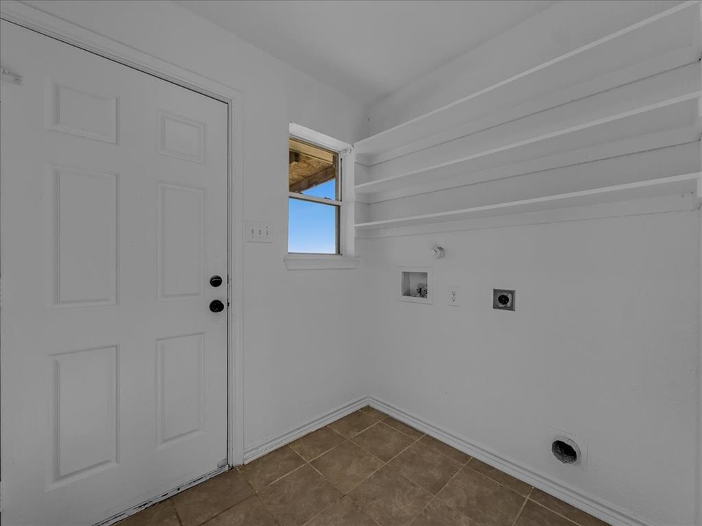 1101 Savanh Street Venus, TX 76084 - Photo 15 of 29 Laundry room with built-in shelves