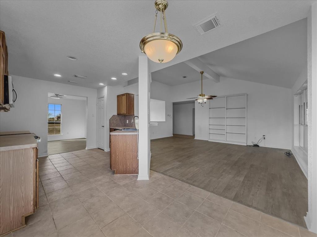 1101 Savanh Street Venus, TX 76084 - Photo 8 of 29 View of eat-in kitchen, living room and dining room