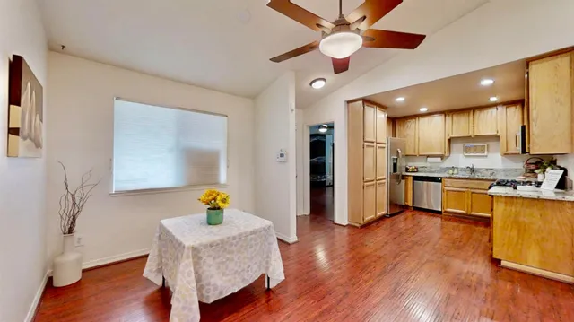 a living room with kitchen island furniture and a wooden floor