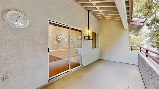 a view of a room that has a table and chair in it