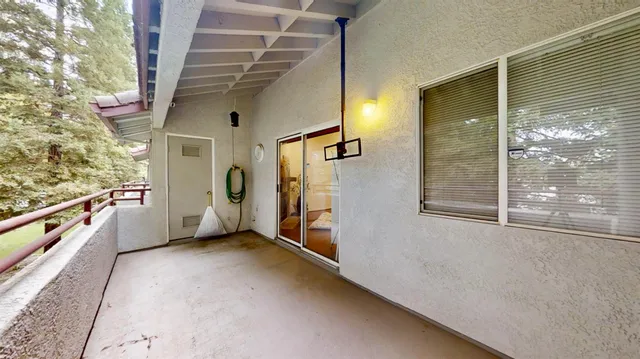 a kitchen with stainless steel appliances granite countertop a refrigerator a stove top oven and wooden floors