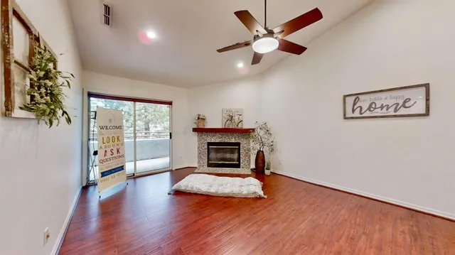 a room with a wooden cabinets and stainless steel appliances