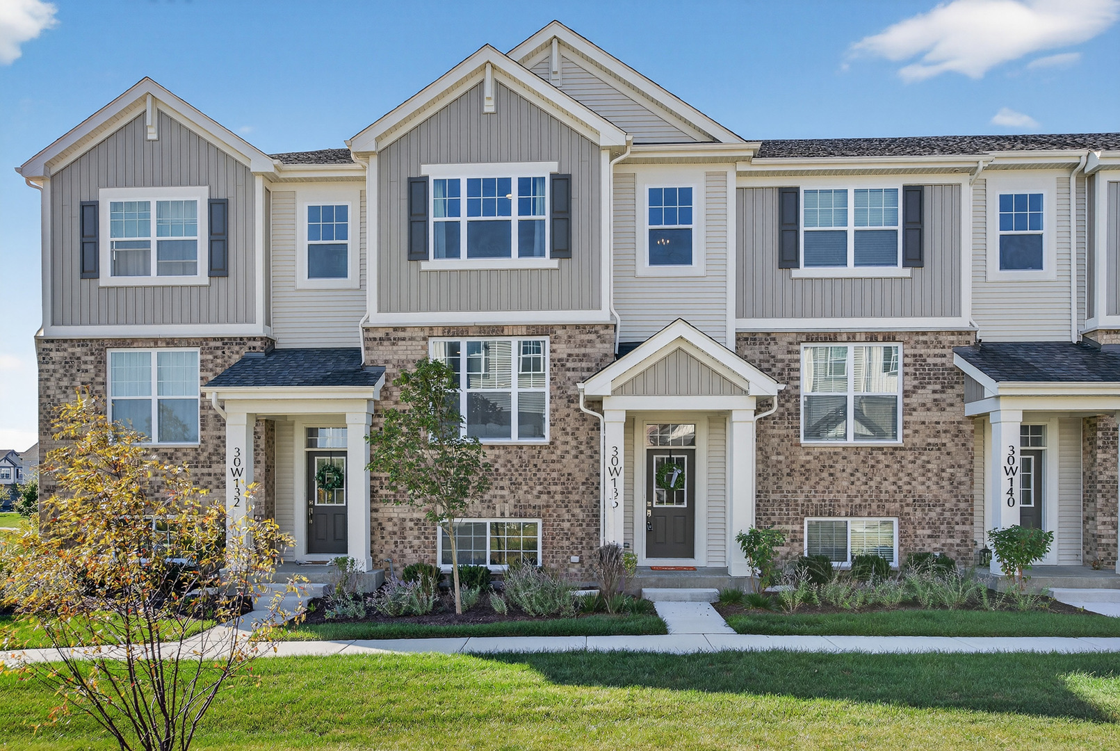 30-w136 Wheeler Circle Aurora, IL 60502 - Photo 1 of 23 front view of a house with a yard