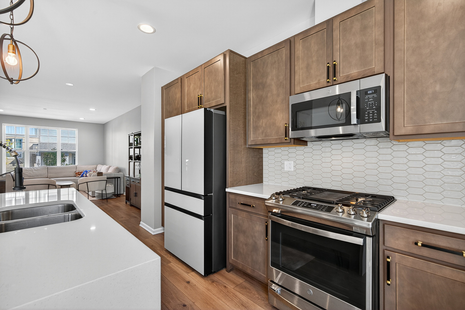 30-w136 Wheeler Circle Aurora, IL 60502 - Photo 7 of 23 a kitchen with stainless steel appliances a stove a microwave and a refrigerator